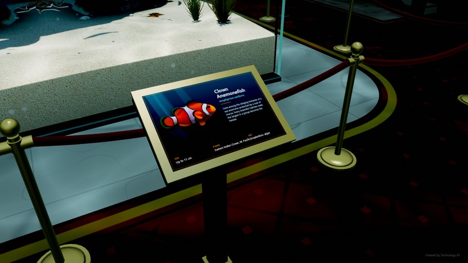 A brass-framed plaque about the clown anemonefish beside the velvet rope